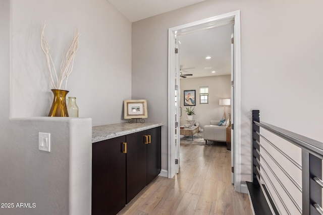 corridor with light hardwood / wood-style flooring