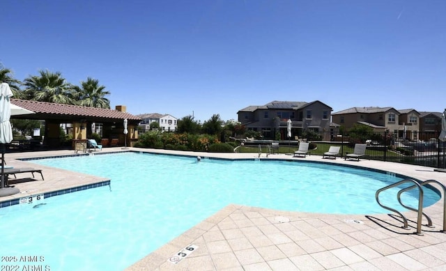 view of swimming pool featuring a patio area