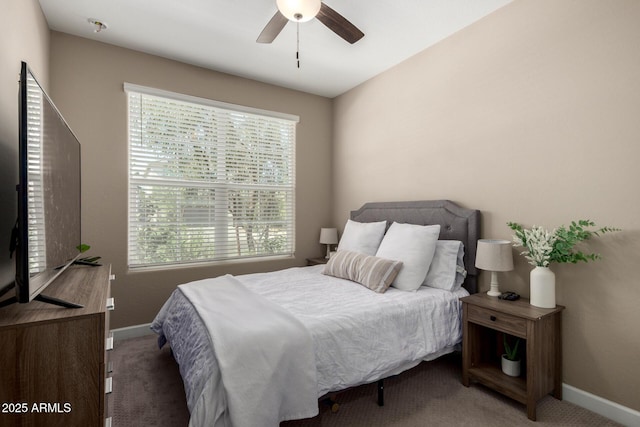 bedroom with baseboards, ceiling fan, and carpet