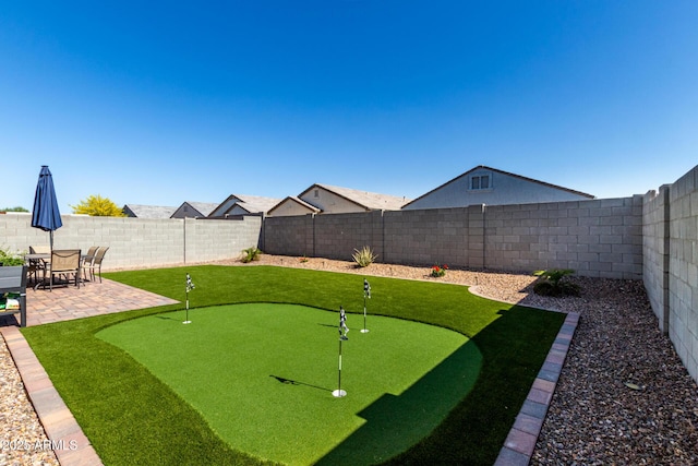 view of yard with a patio and a fenced backyard