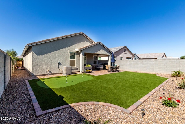 rear view of house with stucco siding, a fenced backyard, central AC unit, an outdoor living space, and a patio