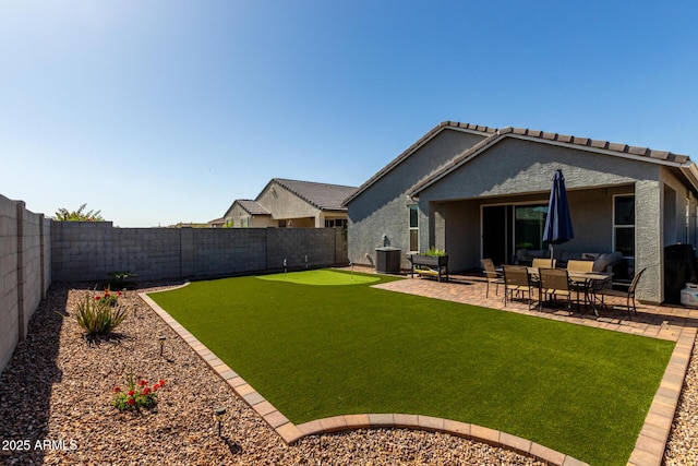 view of yard with a fenced backyard and a patio