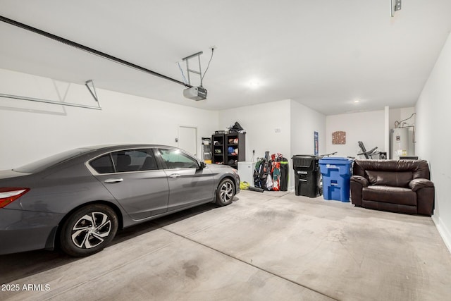 garage with a garage door opener and electric water heater