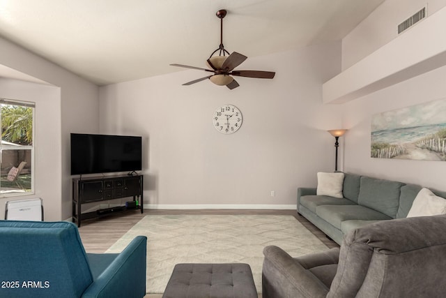 living room featuring lofted ceiling and ceiling fan