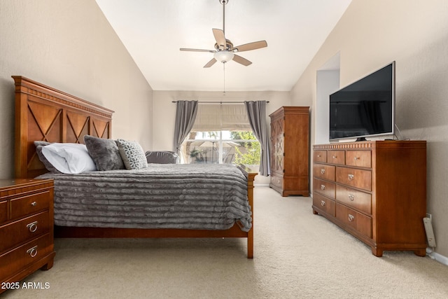 carpeted bedroom featuring lofted ceiling and ceiling fan