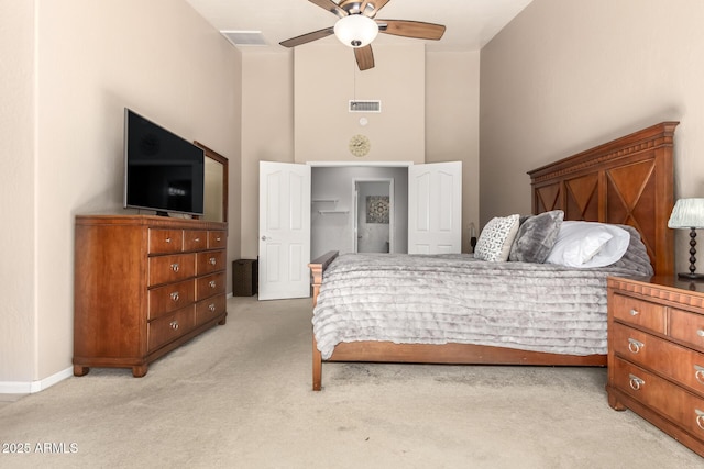 bedroom featuring light colored carpet and ceiling fan