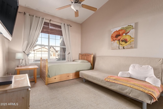 bedroom with vaulted ceiling, light colored carpet, and ceiling fan