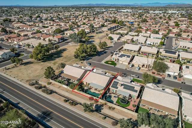 birds eye view of property with a mountain view