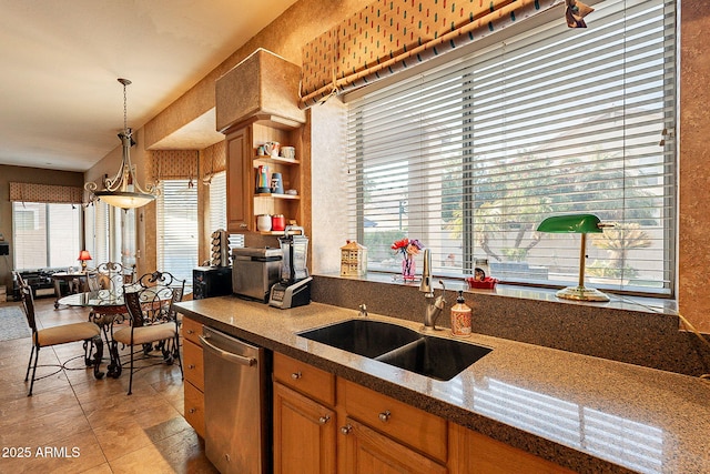 4554 W Detroit St, Chandler, AZ 85226 - kitchen featuring light tile patterned floors, brown cabinetry, dishwasher, a sink, and decorative light fixtures