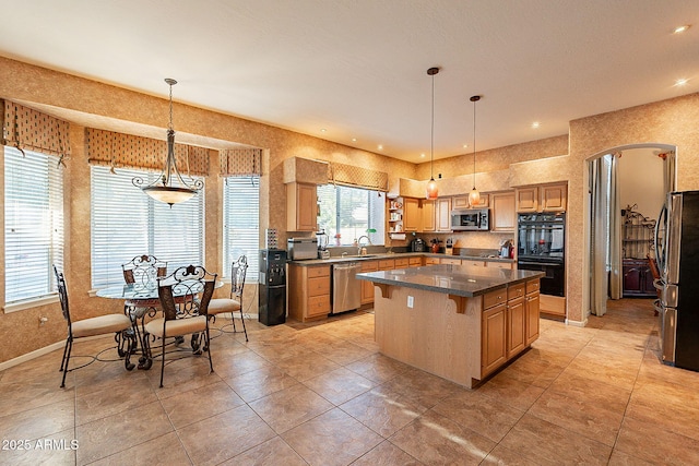 4554 W Detroit St, Chandler, AZ 85226 - kitchen with recessed lighting, a kitchen island, dark countertops, appliances with stainless steel finishes, and hanging light fixtures
