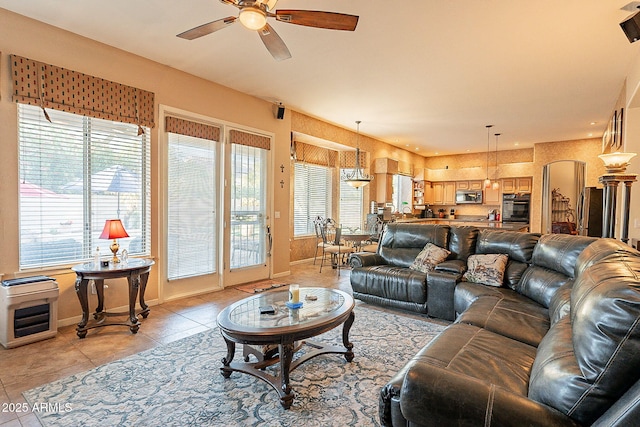 4554 W Detroit St, Chandler, AZ 85226 - living area with light tile patterned floors, a wealth of natural light, a ceiling fan, and baseboards
