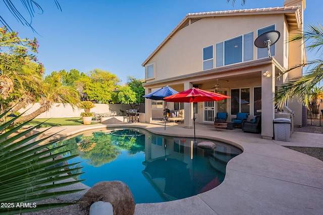 4554 W Detroit St, Chandler, AZ 85226 - back of house with a fenced backyard, stucco siding, a ceiling fan, a patio area, and a fenced in pool