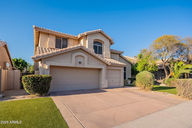 4554 W Detroit St, Chandler, AZ 85226 - mediterranean / spanish home featuring a tiled roof, driveway, stucco siding, and fence