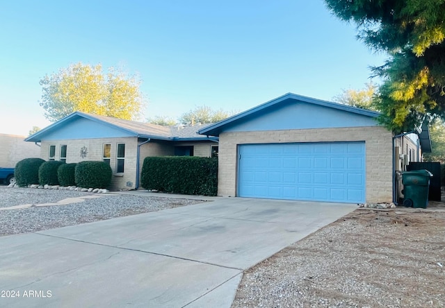 ranch-style home featuring a garage