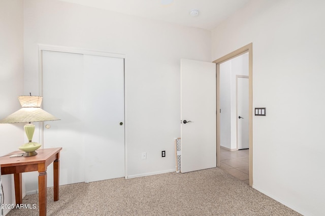 unfurnished bedroom featuring a closet and carpet flooring