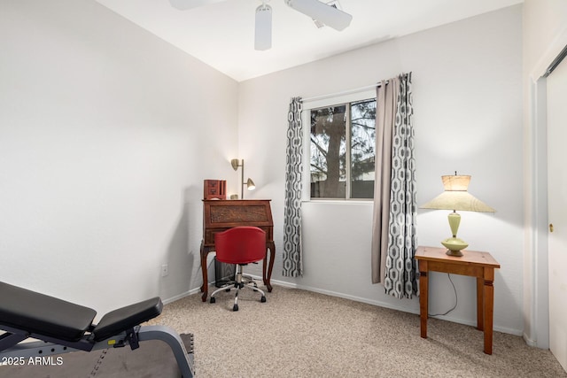 home office featuring carpet floors, baseboards, and a ceiling fan