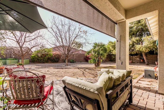 view of patio featuring a fenced backyard and an outdoor living space