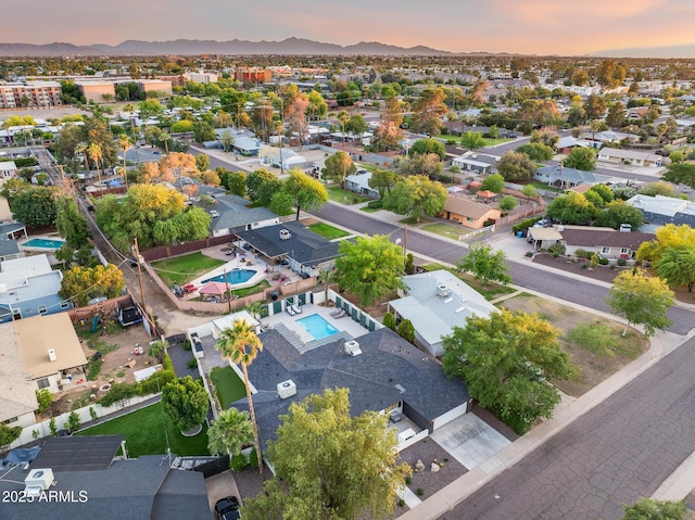 drone / aerial view with a residential view and a mountain view