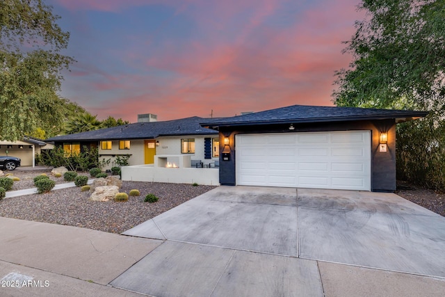 view of front of house with a garage and driveway