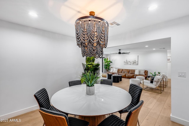 dining area featuring light wood-style floors, recessed lighting, and visible vents