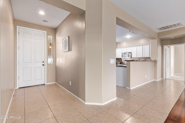 view of tiled foyer entrance