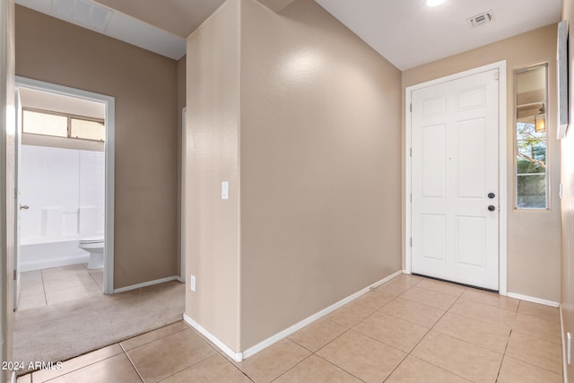 entryway with light tile patterned floors