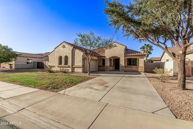 mediterranean / spanish-style home featuring a garage