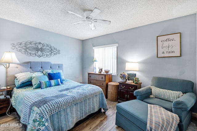 bedroom featuring a textured ceiling, ceiling fan, and wood finished floors