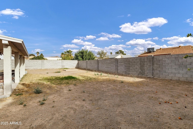 view of yard with a fenced backyard