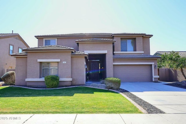 view of front of house featuring a garage and a front yard