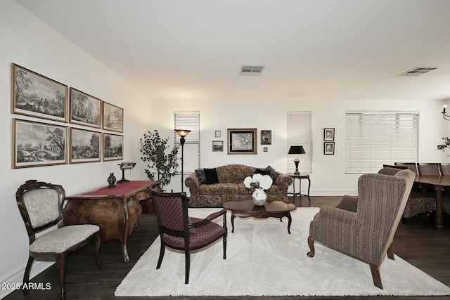 living room with dark hardwood / wood-style flooring