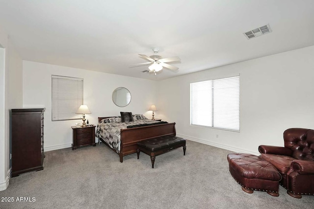 bedroom with light carpet and ceiling fan