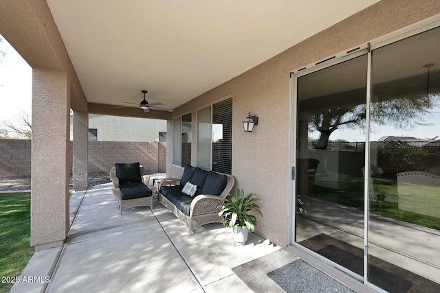 view of patio featuring ceiling fan and outdoor lounge area