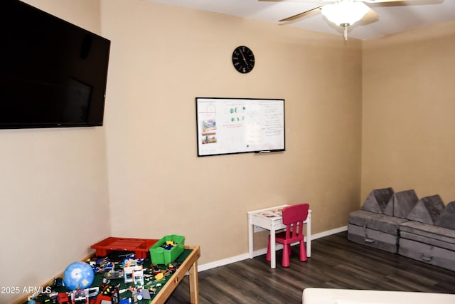 rec room featuring ceiling fan and dark wood-type flooring