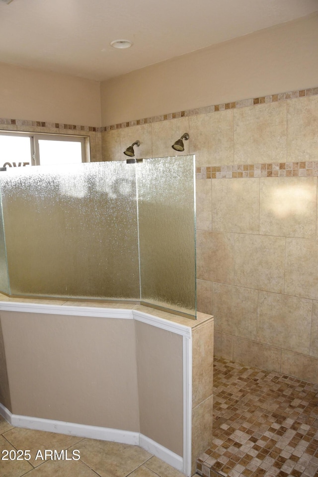 bathroom featuring tile patterned floors and a shower