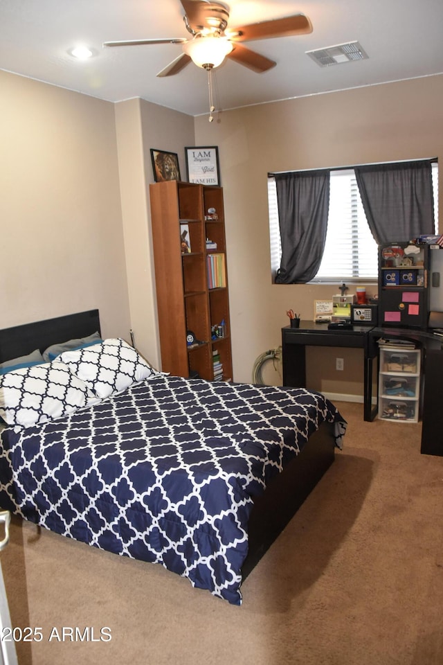 bedroom with ceiling fan and carpet floors