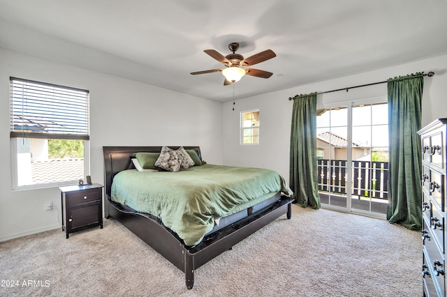 bedroom with light carpet, access to exterior, and ceiling fan