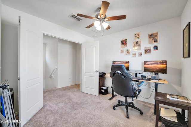 carpeted office featuring ceiling fan