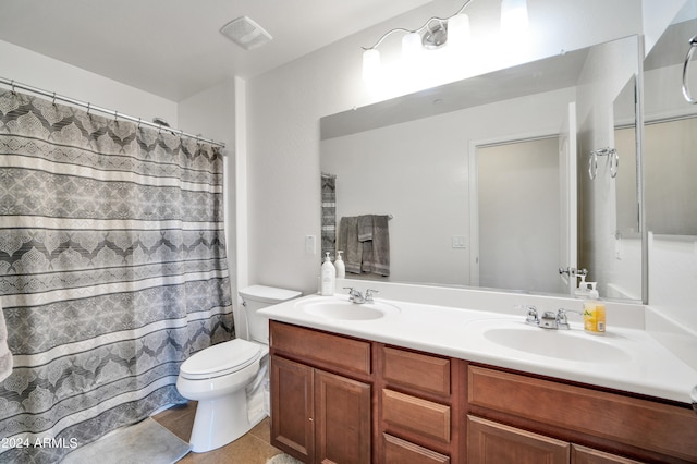 bathroom with a shower with curtain, tile patterned flooring, toilet, and vanity