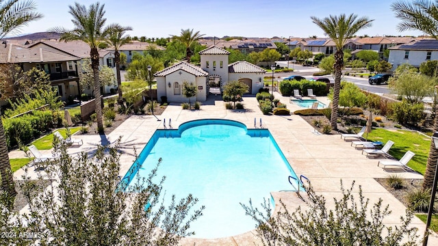 view of swimming pool with a patio