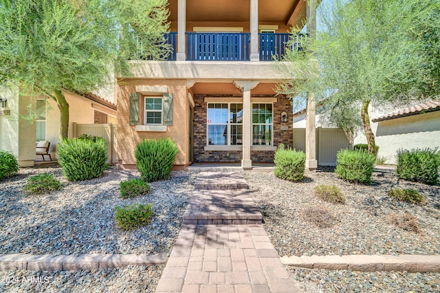 entrance to property with a balcony