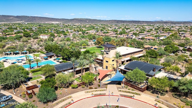 birds eye view of property with a mountain view