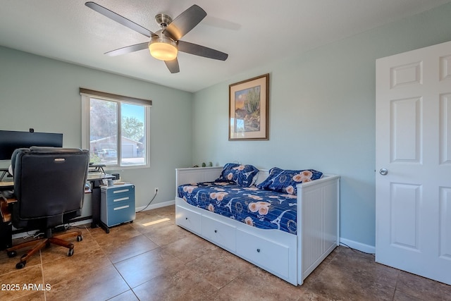 bedroom with baseboards and ceiling fan