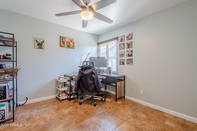 office area with baseboards and ceiling fan