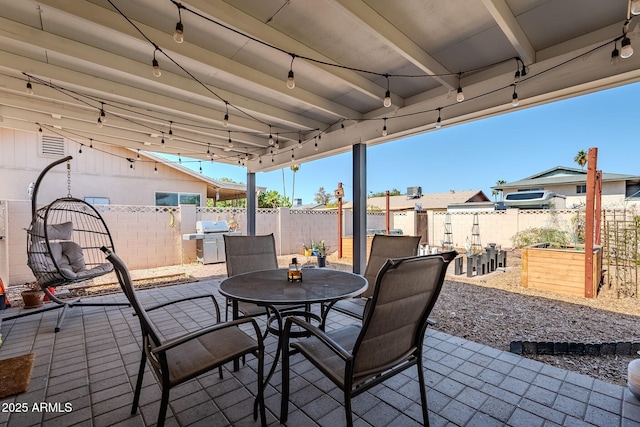 view of patio / terrace featuring outdoor dining area, a grill, and a fenced backyard