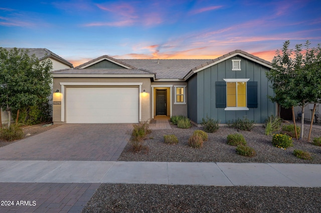 ranch-style home with a garage