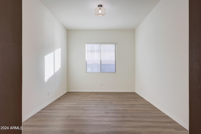 spare room with light wood-type flooring