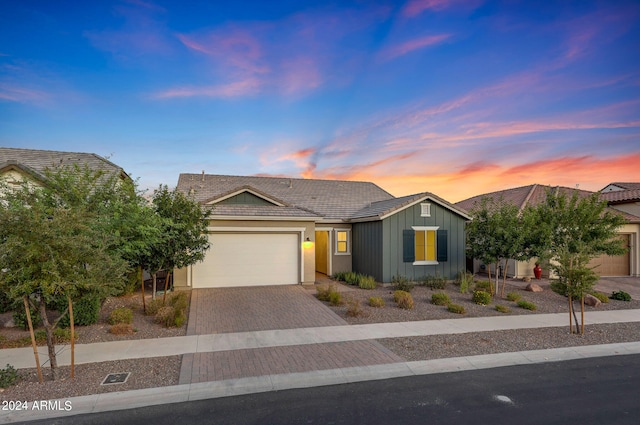 single story home featuring a garage