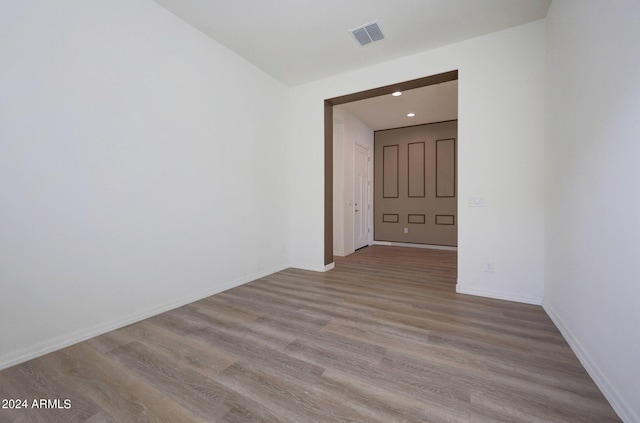 unfurnished room with light hardwood / wood-style flooring