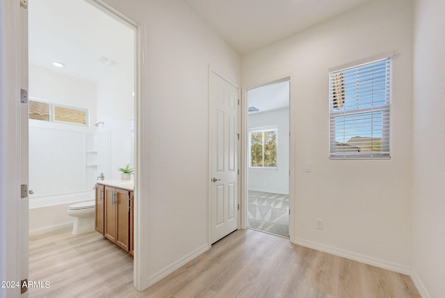 hall with light wood-type flooring